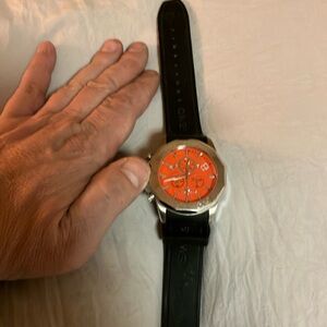 Swiss legend Monte Carlo men’s watch beautiful orange face. Classy.